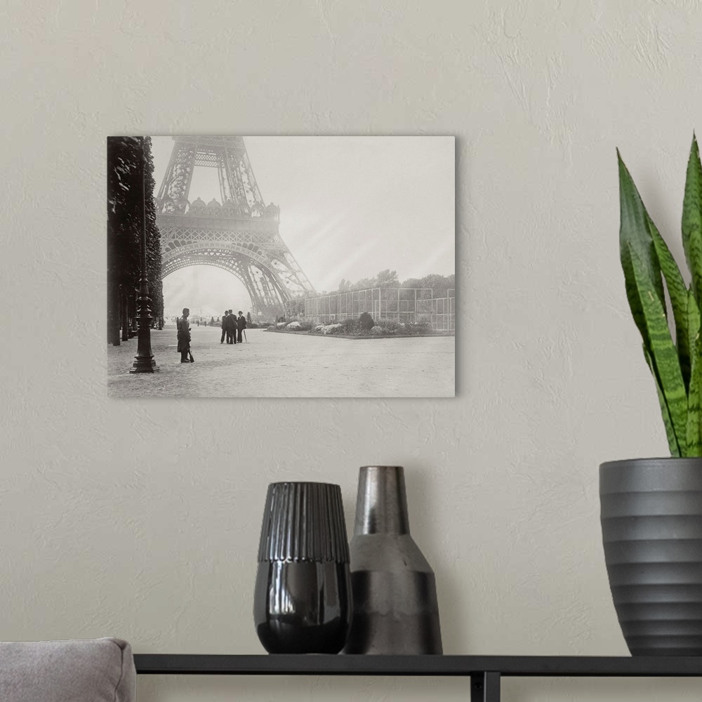 A modern room featuring Vintage black and white photograph of Paris in front of the Eiffel Tower on a foggy day.