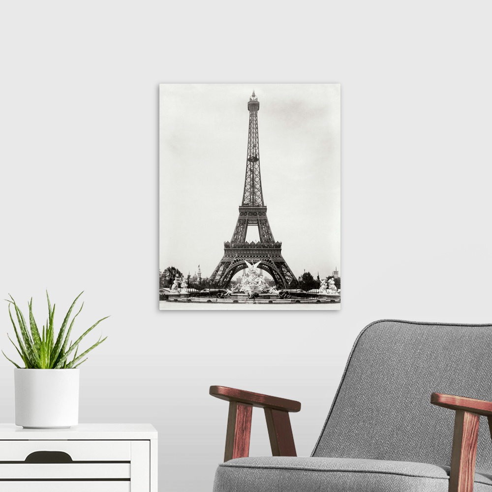 A modern room featuring A vintage photograph of the Eiffel Tower in Paris.
