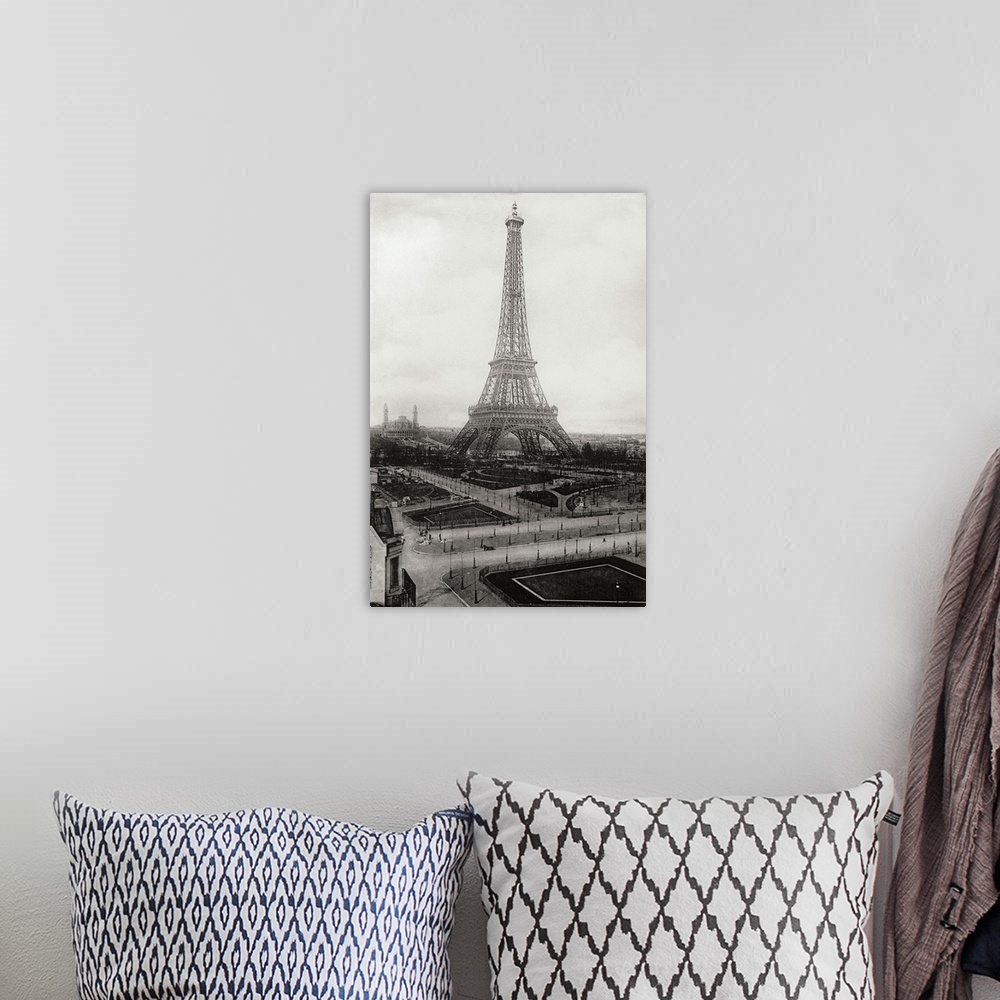 A bohemian room featuring Black and white vintage photograph of the Eiffel Tower in Paris.