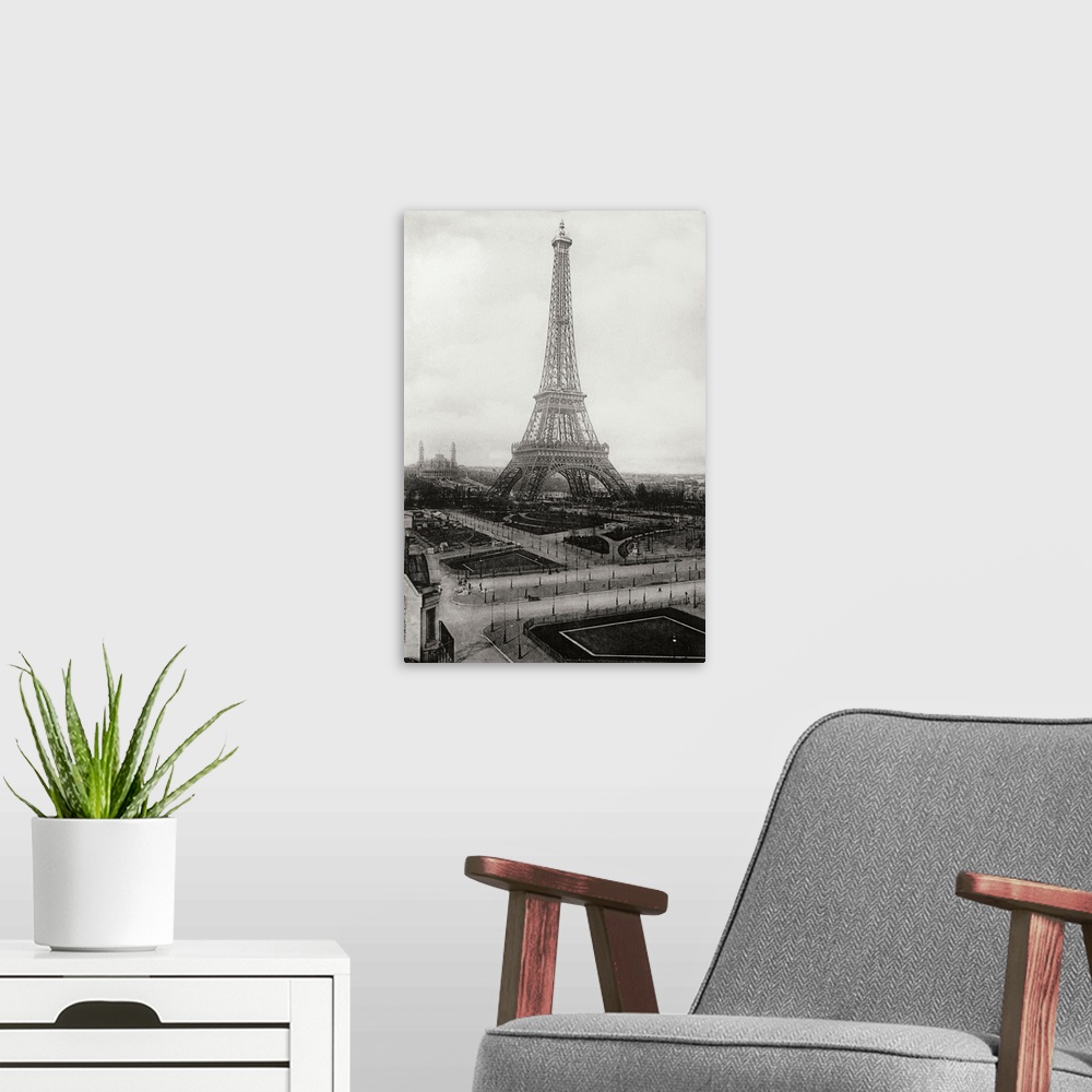 A modern room featuring Black and white vintage photograph of the Eiffel Tower in Paris.