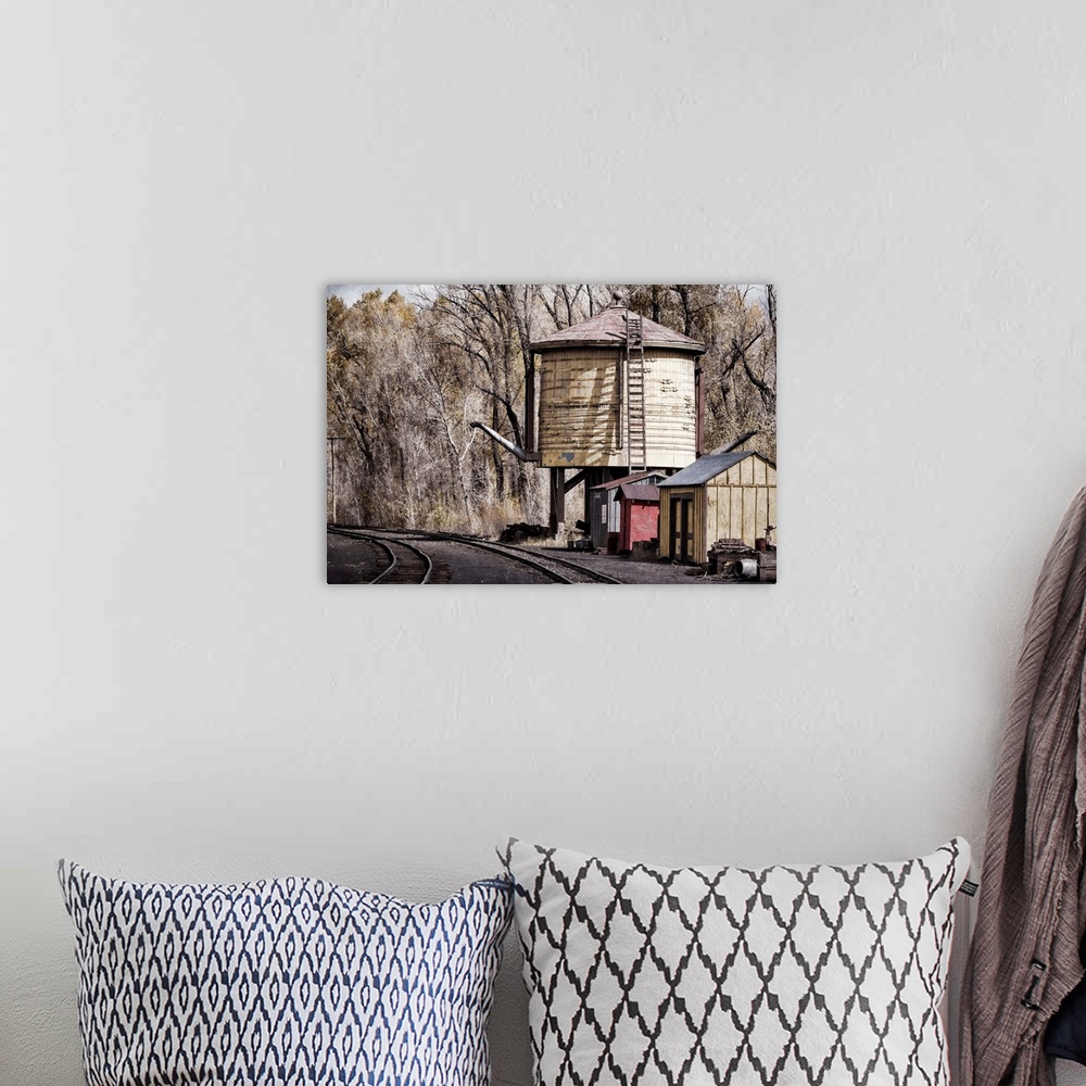 A bohemian room featuring Photograph of old railroad tracks.