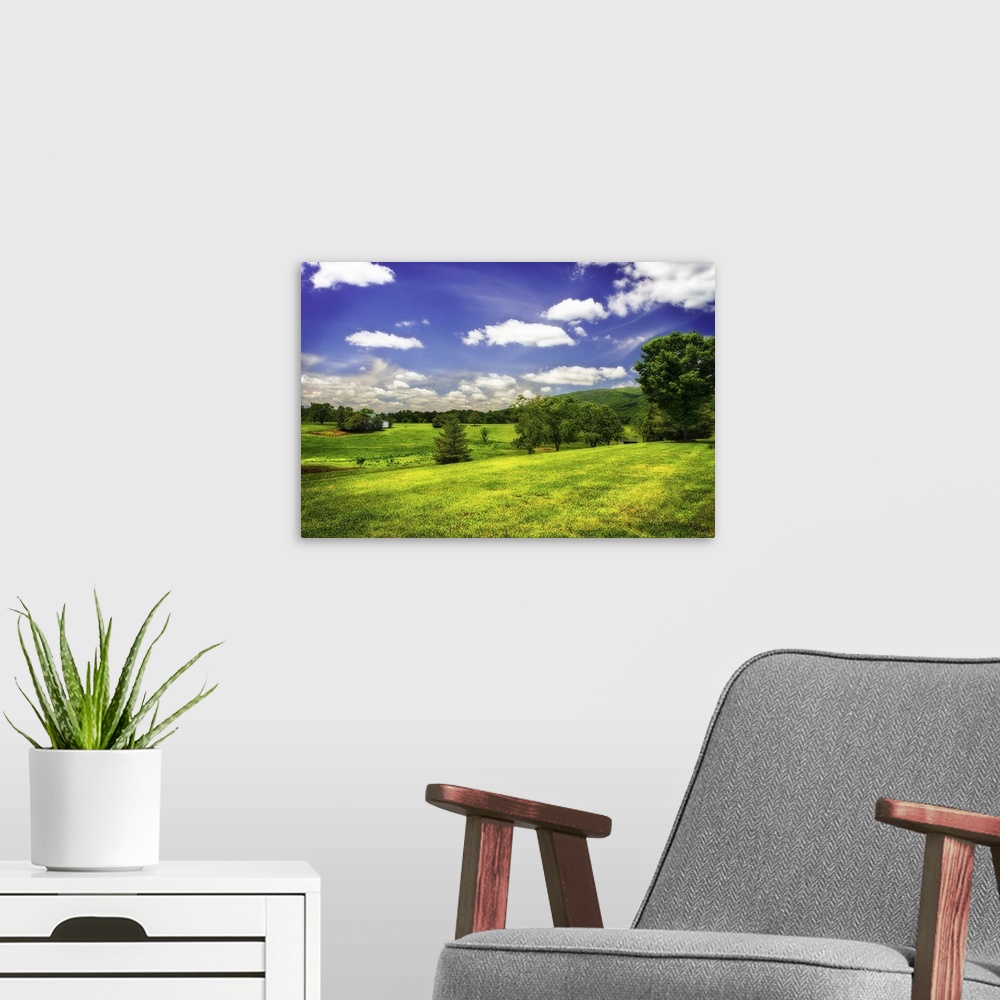 A modern room featuring Rolling green hills in the countryside on a sunny spring day.