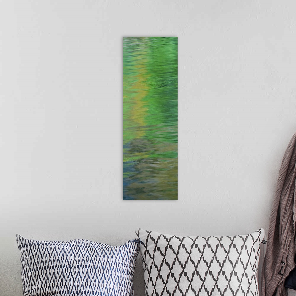 A bohemian room featuring Abstract image of green reflections in the water.