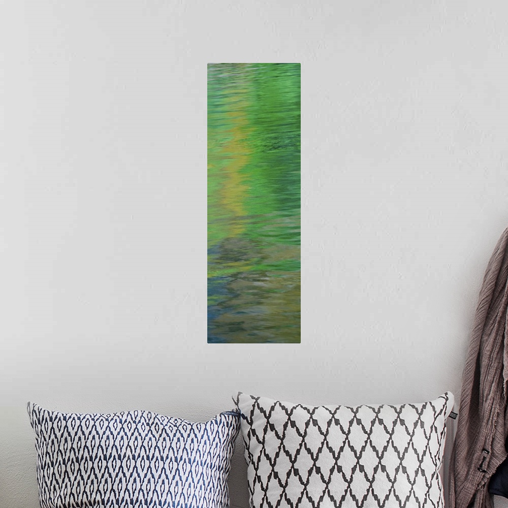 A bohemian room featuring Abstract image of green reflections in the water.