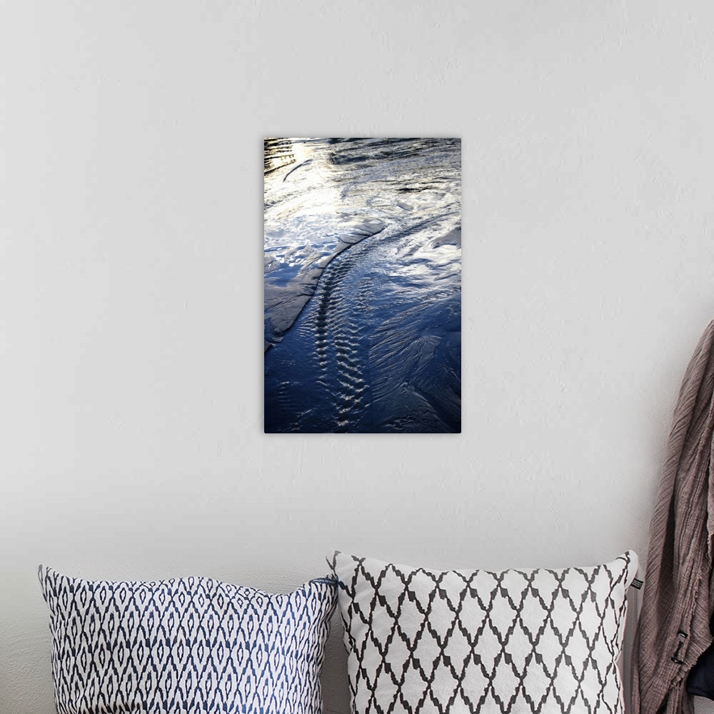 A bohemian room featuring Photograph of water trails with the sunlight reflecting off the blue water.