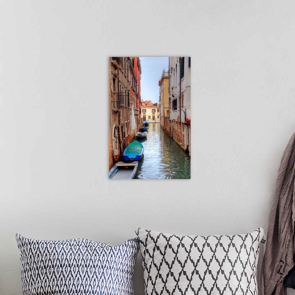 A bohemian room featuring HDR photograph of a canal flowing through the alleys of Venice, Italy, with small boats floating ...