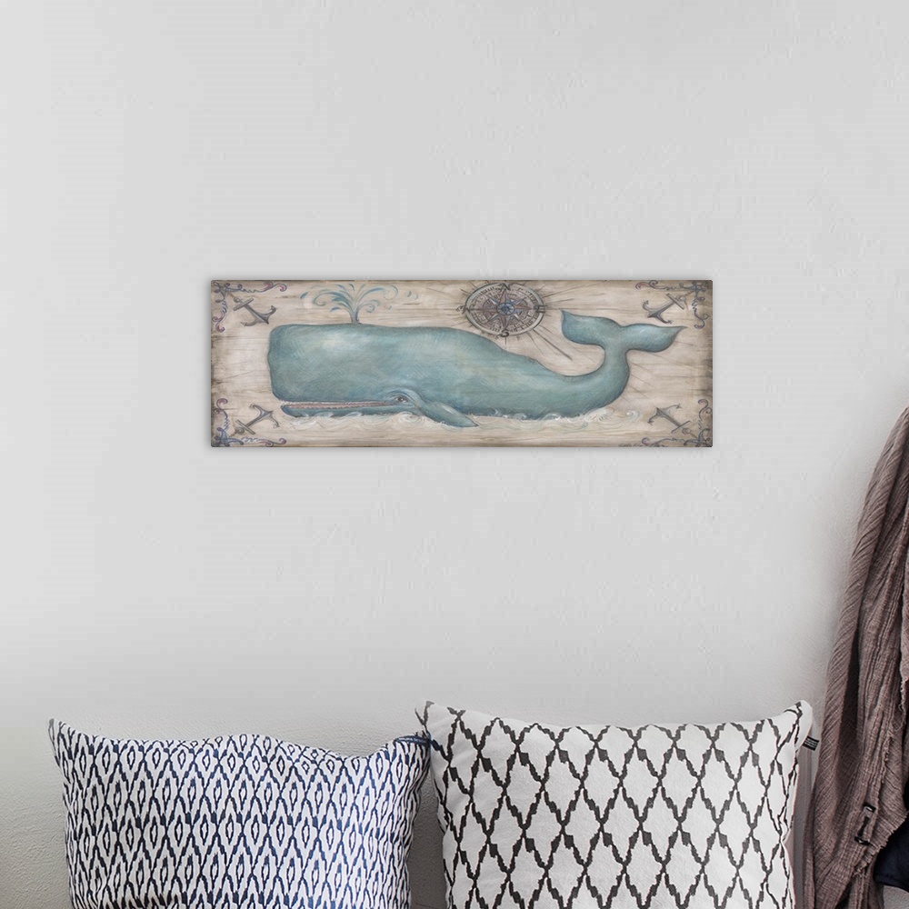 A bohemian room featuring Large painting of a whale spewing water out of its blowhole with a blue and red compass rose abov...