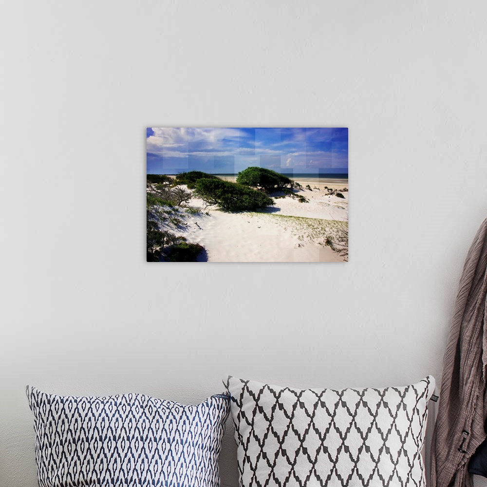 A bohemian room featuring A sandy beach under a bright blue sky, with square shapes in the sky.