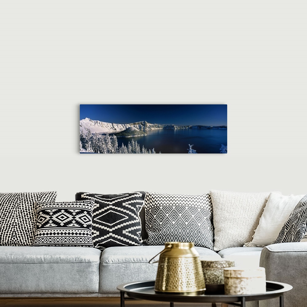 A bohemian room featuring Panoramic photograph of Crater Lake surrounded by snow covered mountains in Crater Lake National ...
