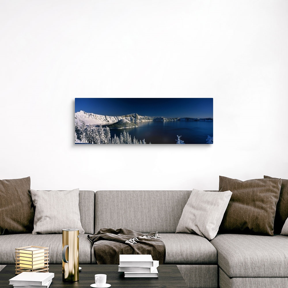 A traditional room featuring Panoramic photograph of Crater Lake surrounded by snow covered mountains in Crater Lake National ...
