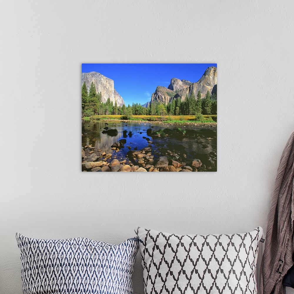 A bohemian room featuring A river running through Yosemite Valley, near Half Dome.