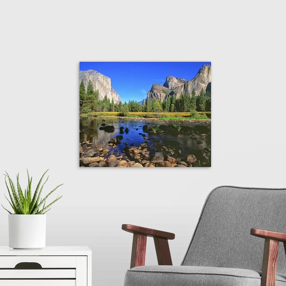 A modern room featuring A river running through Yosemite Valley, near Half Dome.