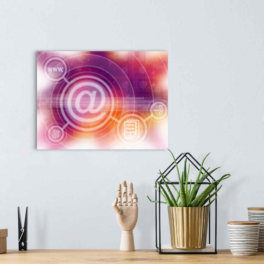A bohemian room featuring a computer screen icon of the @ sign with symbols superimposed