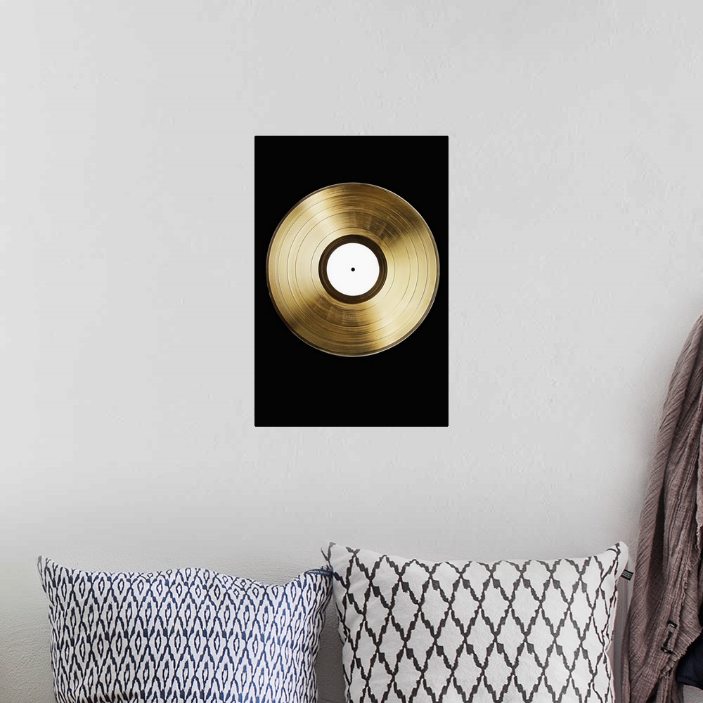 A bohemian room featuring A gold record on a black background