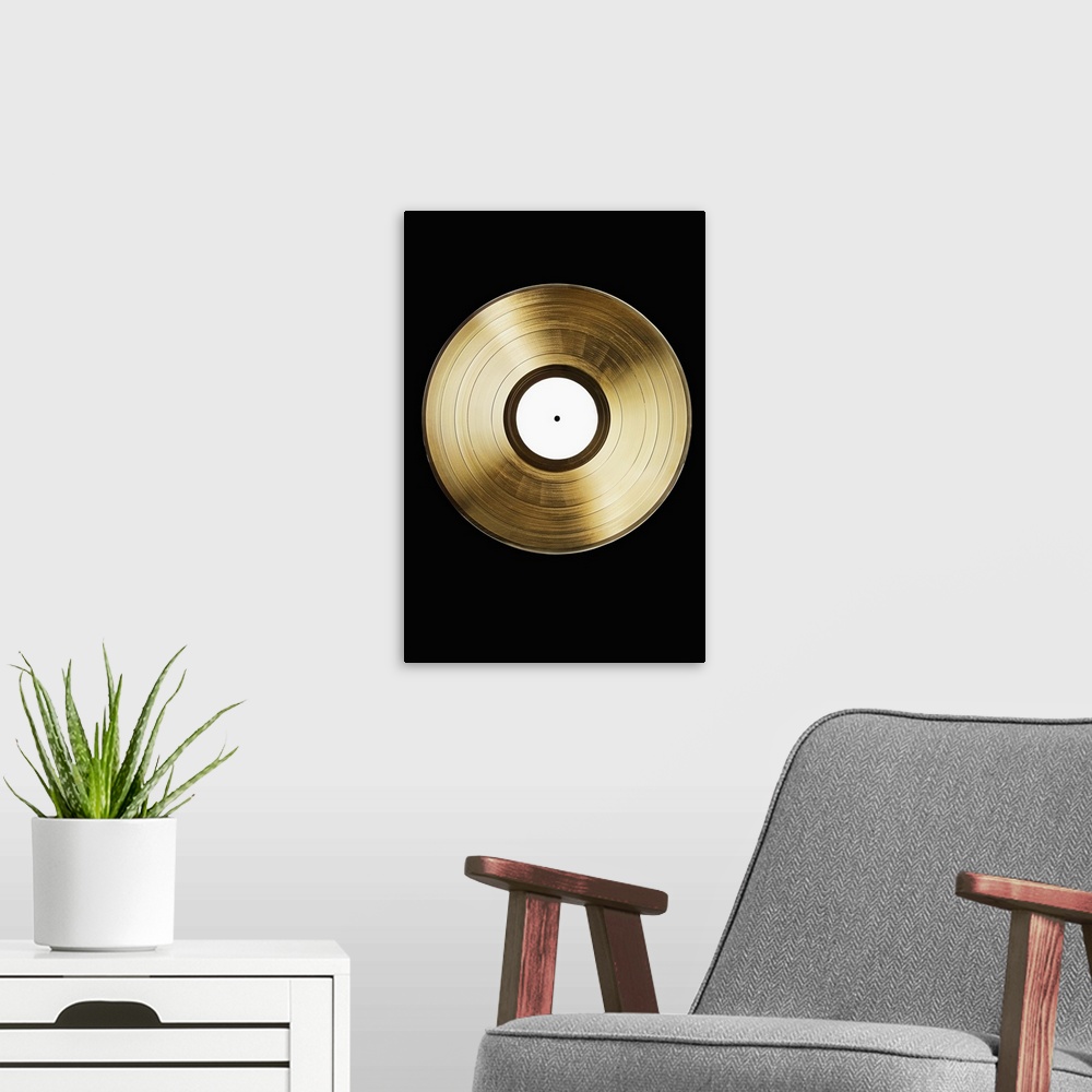 A modern room featuring A gold record on a black background