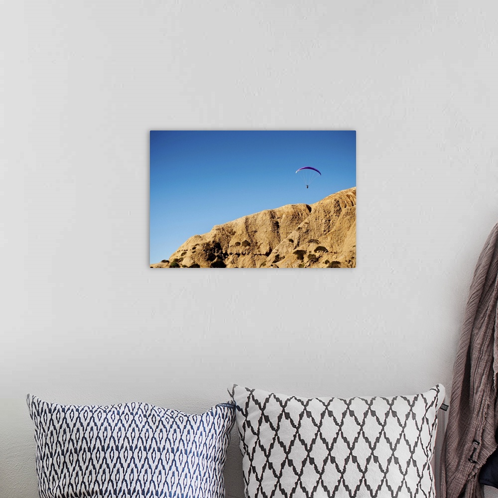 A bohemian room featuring A hang glider floats above the cliffs of Torrey Pines over La Jolla, California.