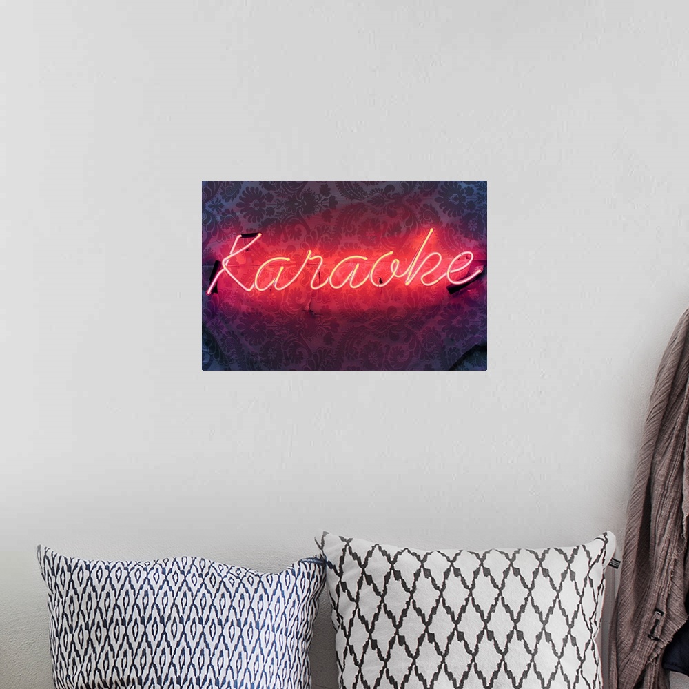 A bohemian room featuring A Make shift Karaoke Sign on a wall, mounted badly on a wall