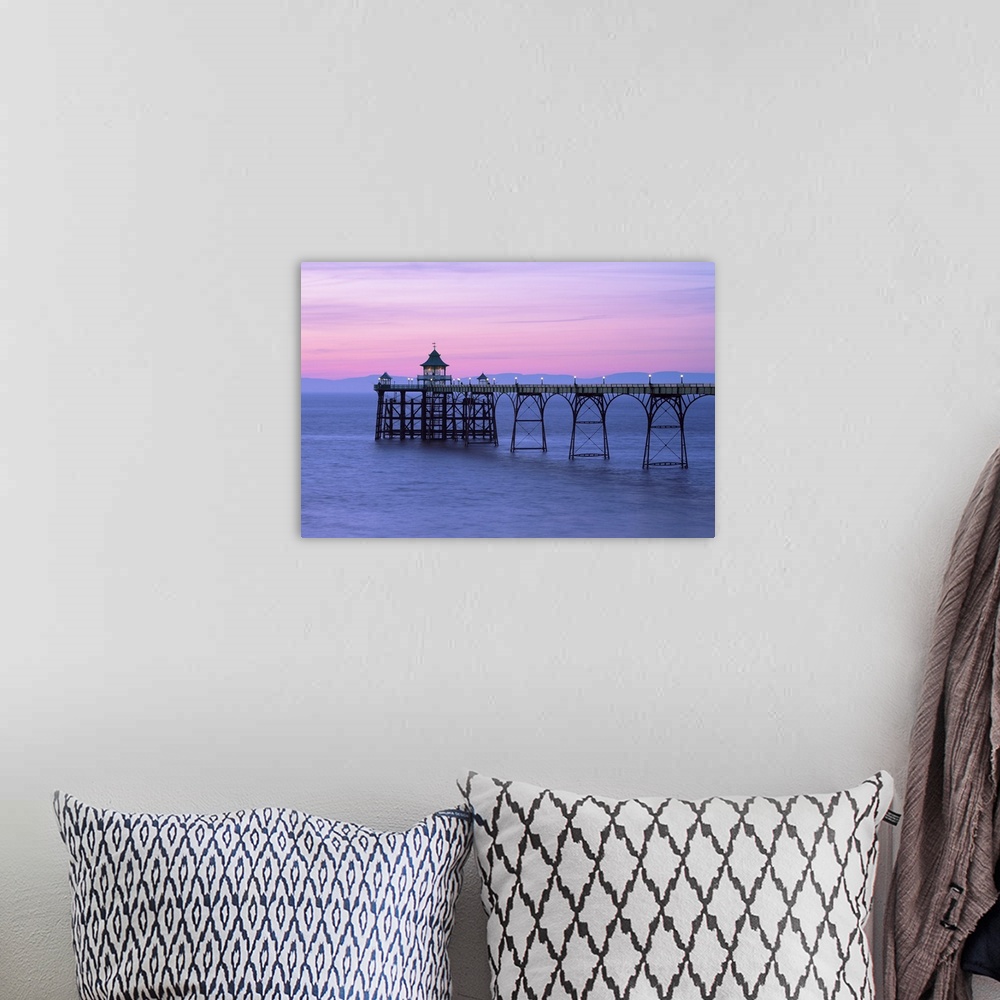 A bohemian room featuring A pink dusk sky over Clevedon Pier in Somerset.
