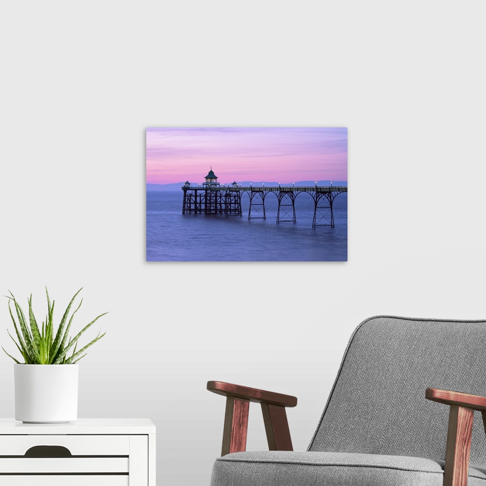 A modern room featuring A pink dusk sky over Clevedon Pier in Somerset.