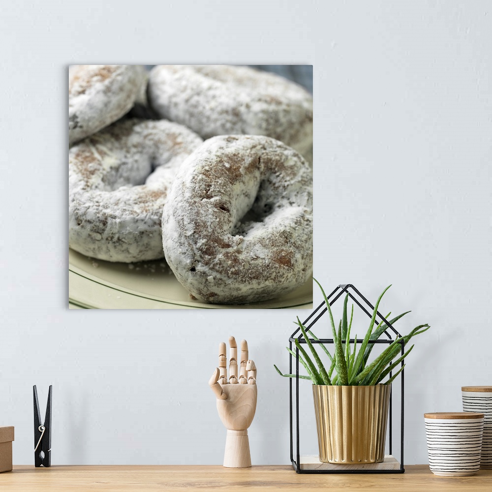 A bohemian room featuring A plate of sugar donuts aka 'doughnuts'