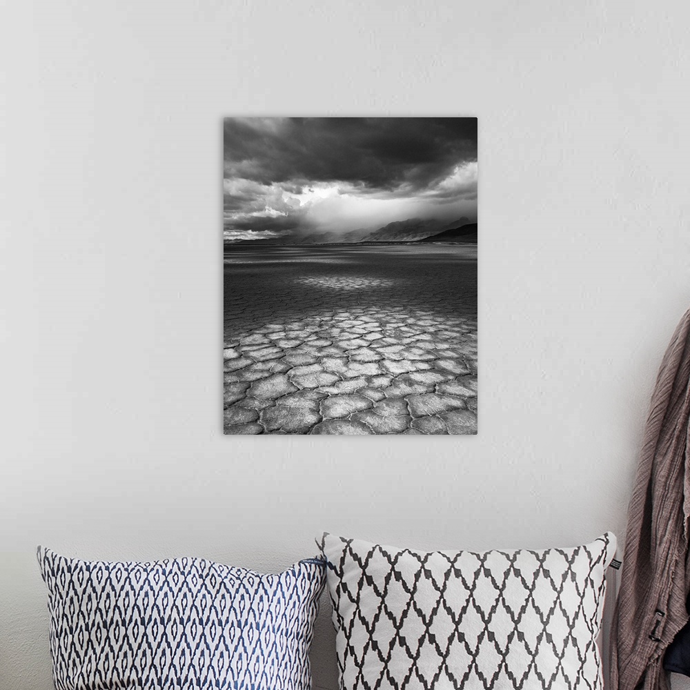 A bohemian room featuring A rainstorm travels over Steens Mountain as seen from the Alvord Desert in Oregon.