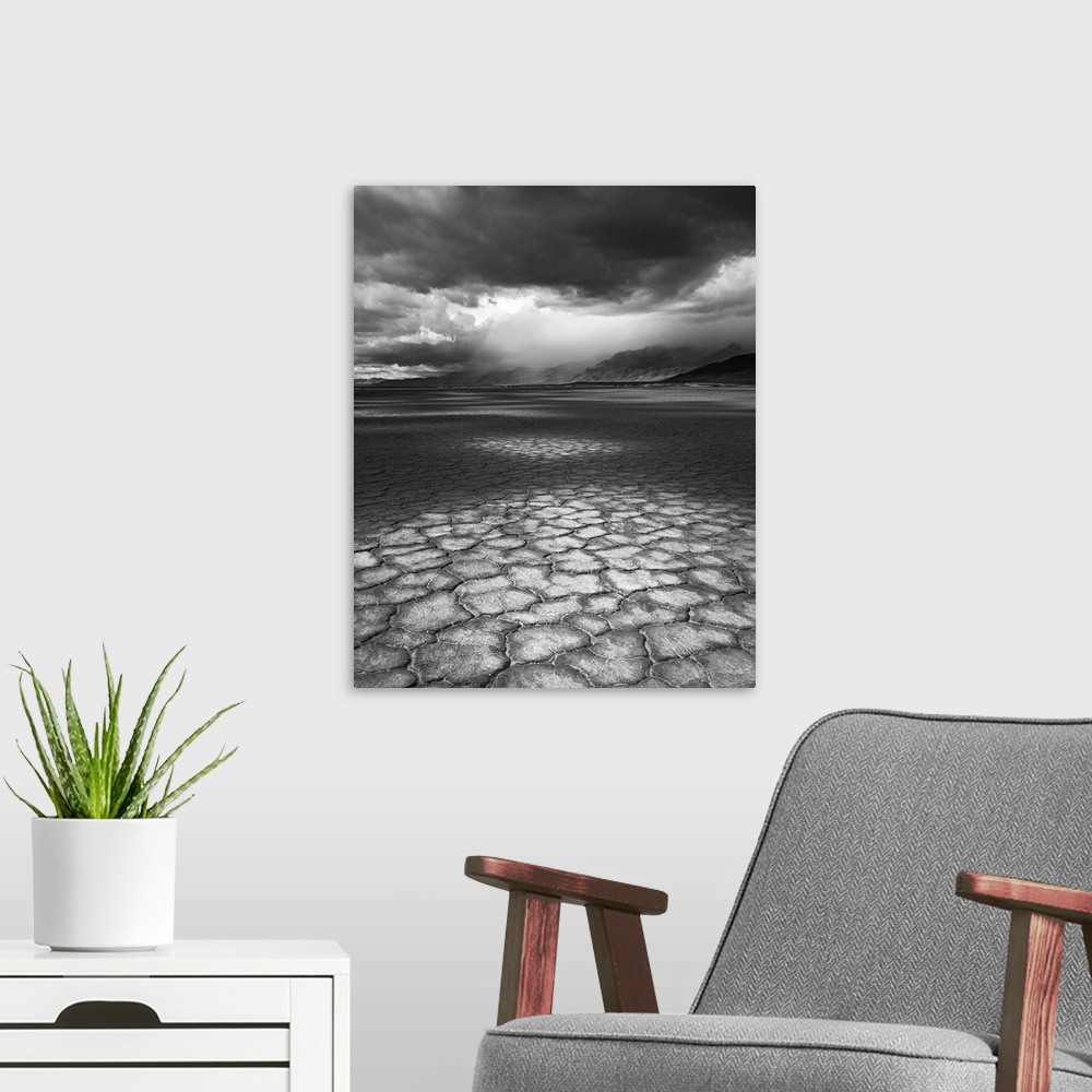 A modern room featuring A rainstorm travels over Steens Mountain as seen from the Alvord Desert in Oregon.