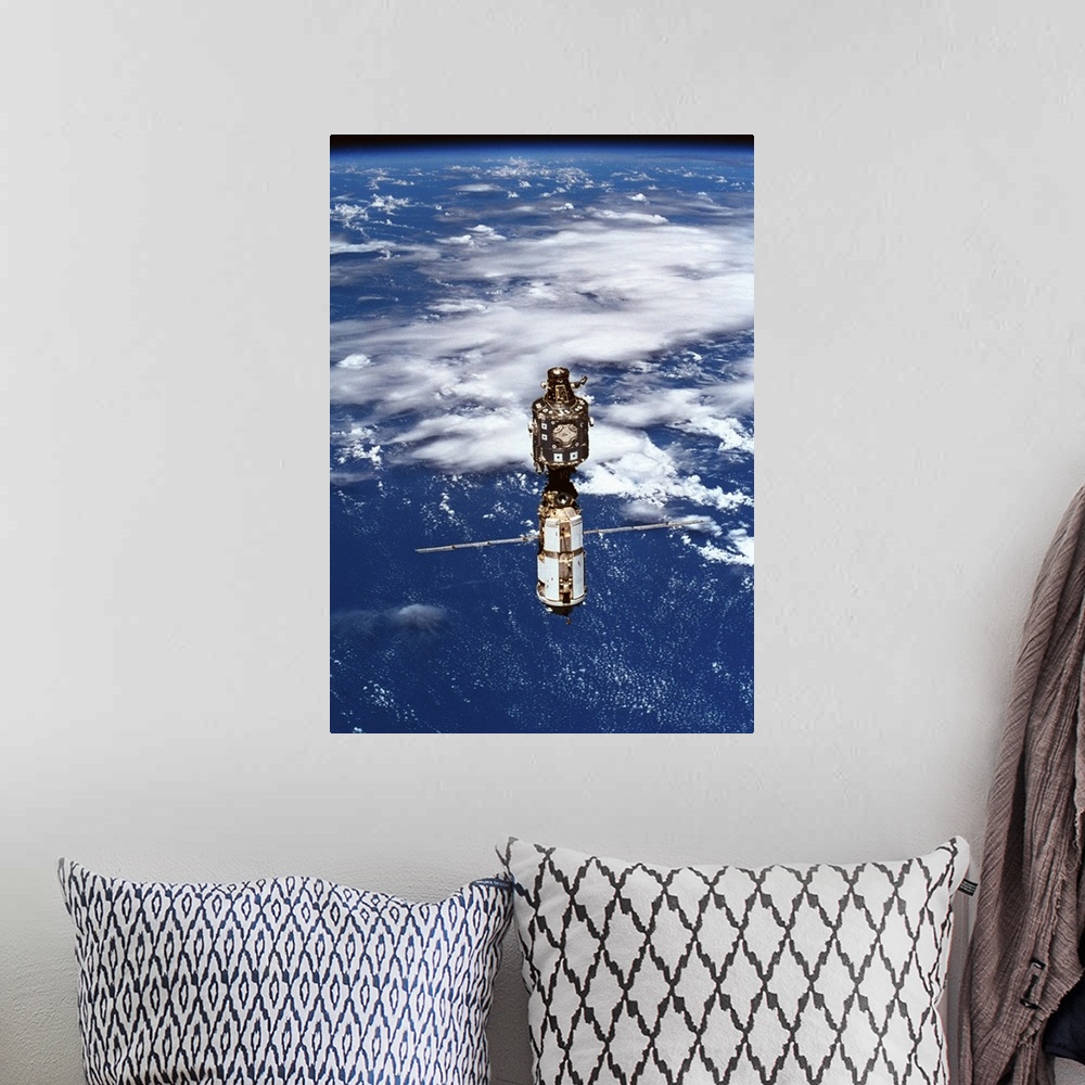 A bohemian room featuring A satellite orbiting above the earth