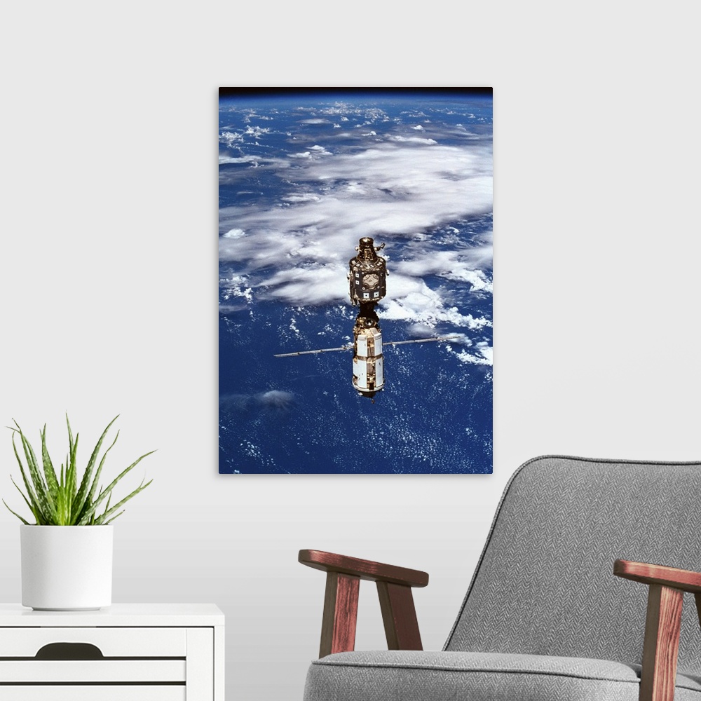 A modern room featuring A satellite orbiting above the earth