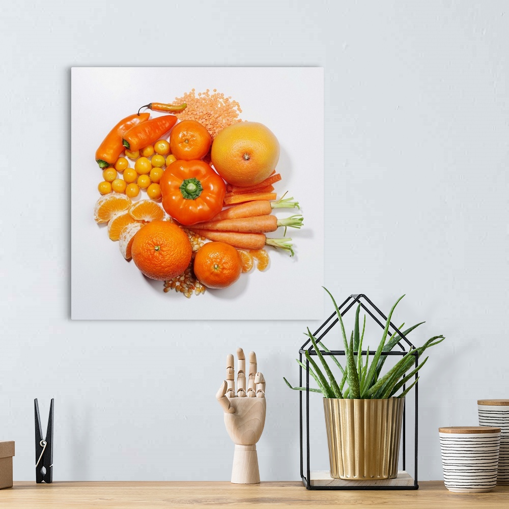 A bohemian room featuring A selection of orange fruits & vegetables.