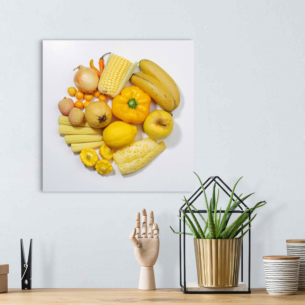 A bohemian room featuring A selection of yellow fruits & vegetables.
