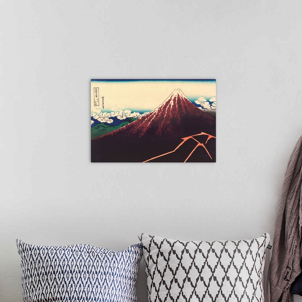A bohemian room featuring A print by Hokusai from the series Thirty-Six Views of Mount Fuji.