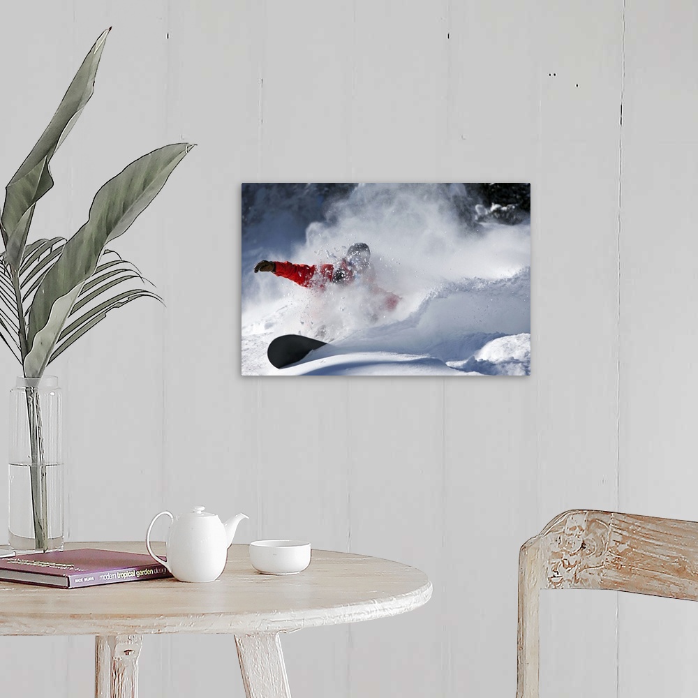 A farmhouse room featuring A snowboarder sending snow flying as they ride down the slopes in Colorado.