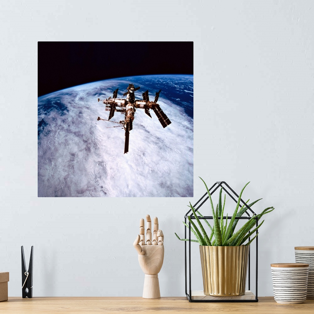 A bohemian room featuring A space station in orbit above the earth