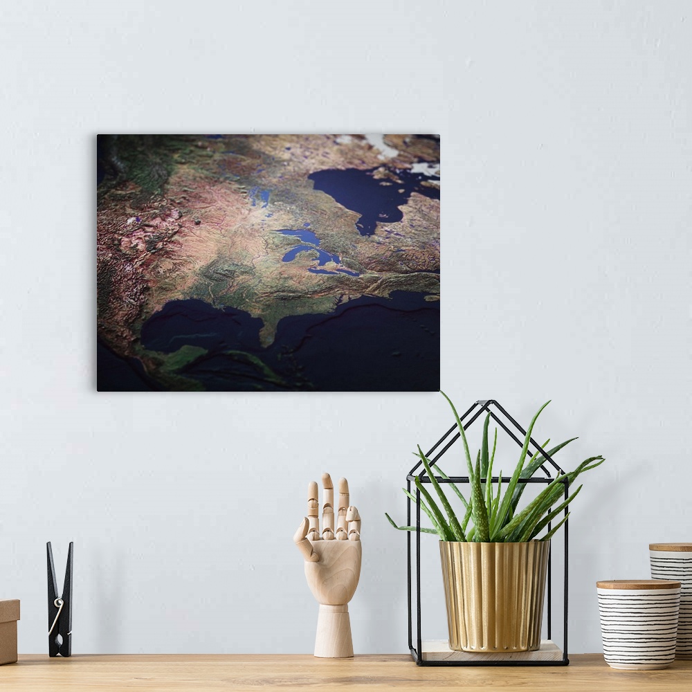 A bohemian room featuring A topographic map of USA from a satellite view