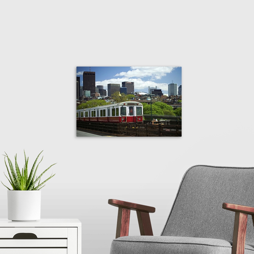 A modern room featuring A train with Boston skyline background