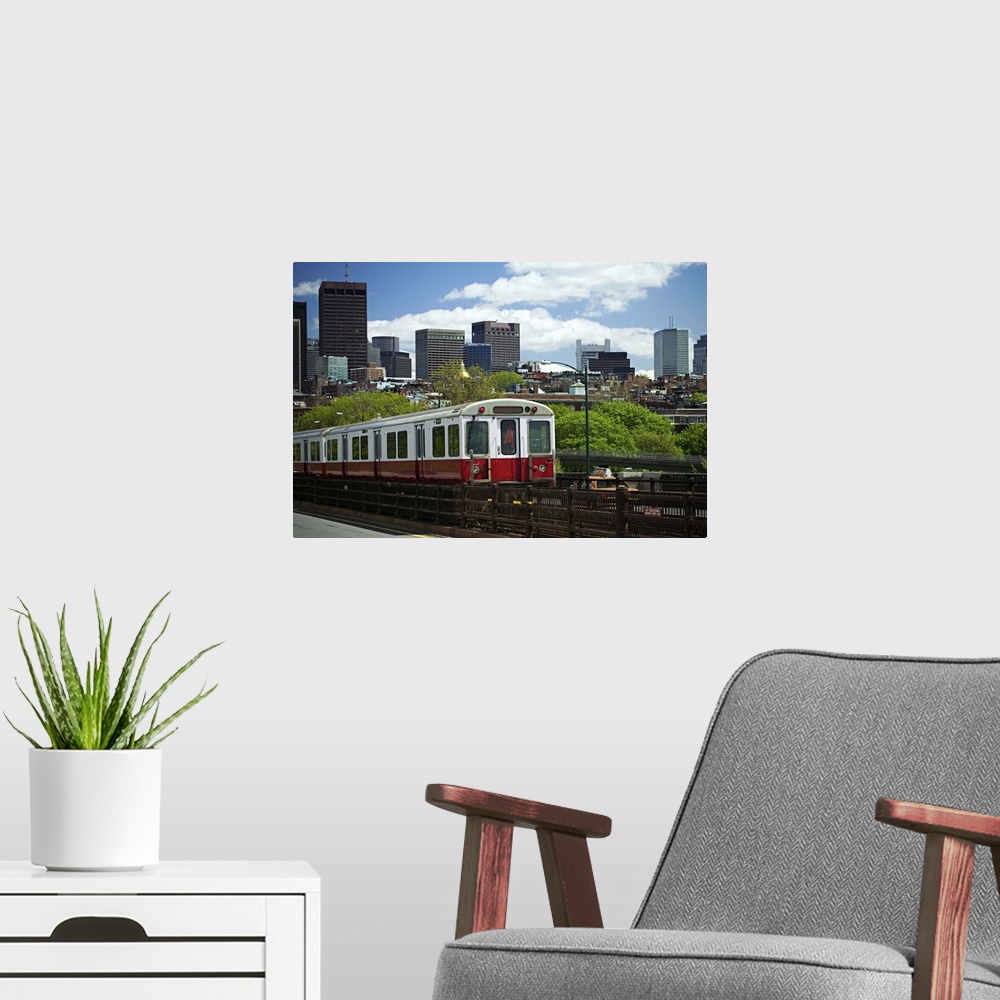 A modern room featuring A train with Boston skyline background