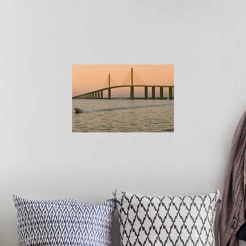 A bohemian room featuring A view of the Sunshine Skyway bridge spanning the Tampa bay.