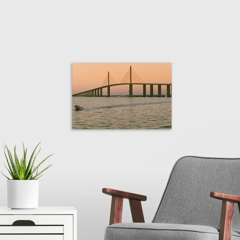 A modern room featuring A view of the Sunshine Skyway bridge spanning the Tampa bay.