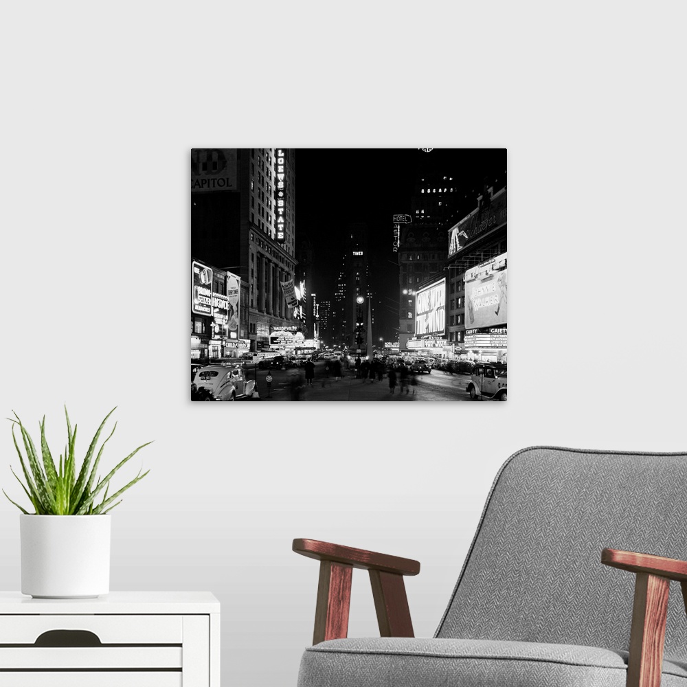 A modern room featuring A View Of Times Square At Night