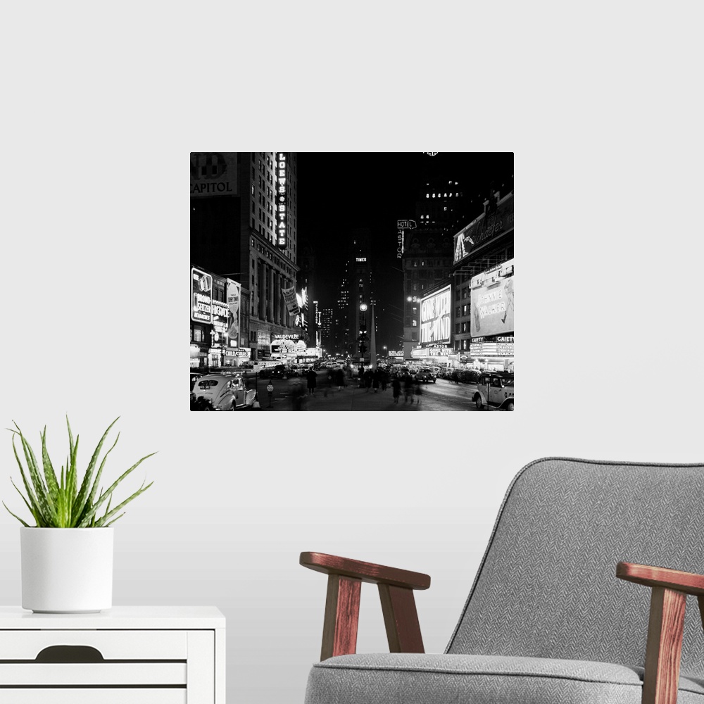 A modern room featuring A View Of Times Square At Night
