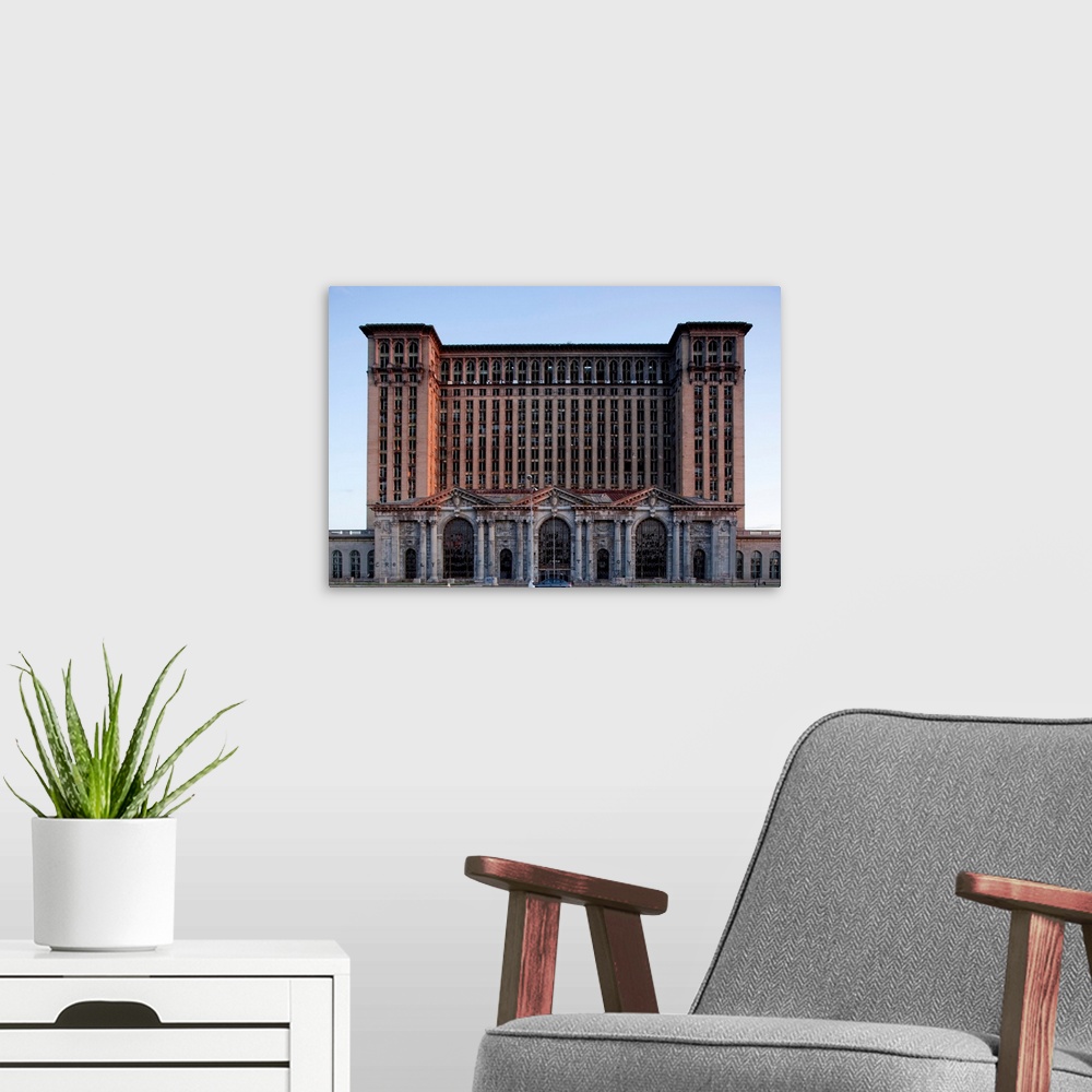 A modern room featuring Abandoned Michigan Central Station in downtown at sunset on a summer evening.
