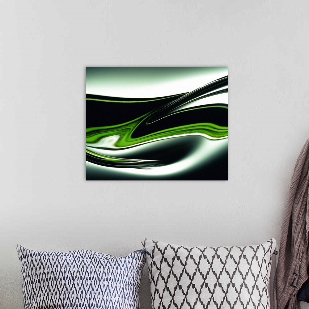 A bohemian room featuring Abstract canvas painting of dark curving lines going through a gradient.
