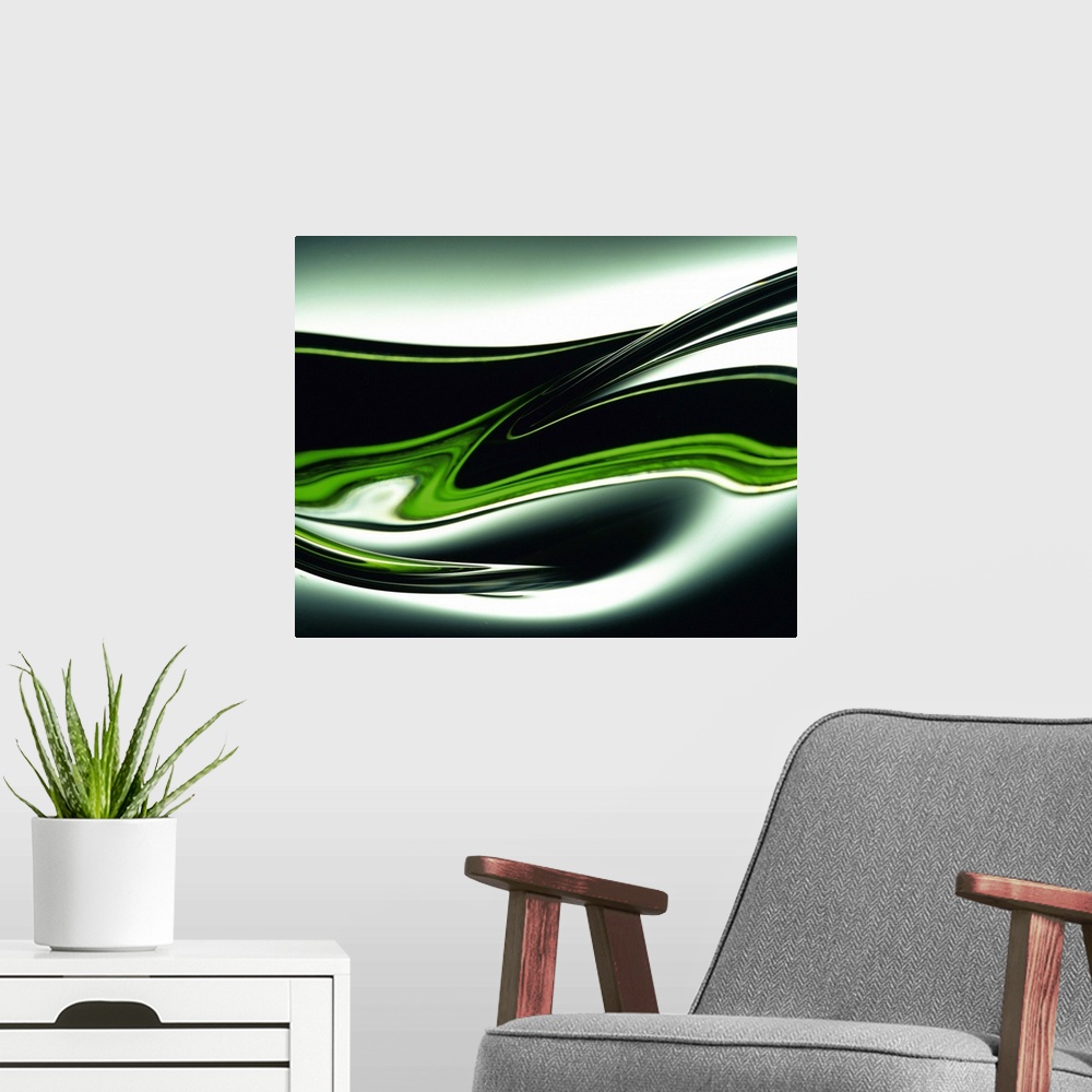 A modern room featuring Abstract canvas painting of dark curving lines going through a gradient.