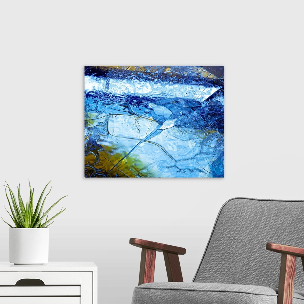 A modern room featuring Abstract artwork of a sheet of ice that has cracked and been shattered in one spot.