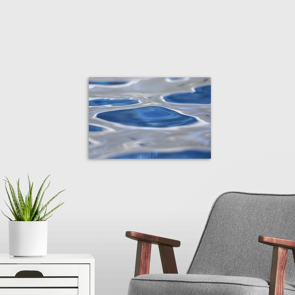 A modern room featuring Up close view of the surface of water in a pool on canvas.