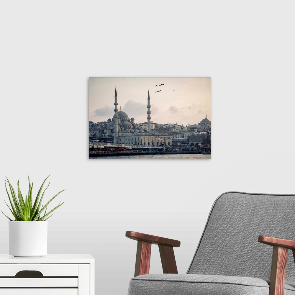 A modern room featuring Istanbul. To the left is the Galata Bridge; on the lower level you can see the neon signs of rest...