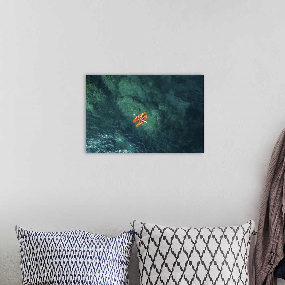 A bohemian room featuring Aerial picture of two girls practicing kayak in a paradise place of the costa brava beach with be...