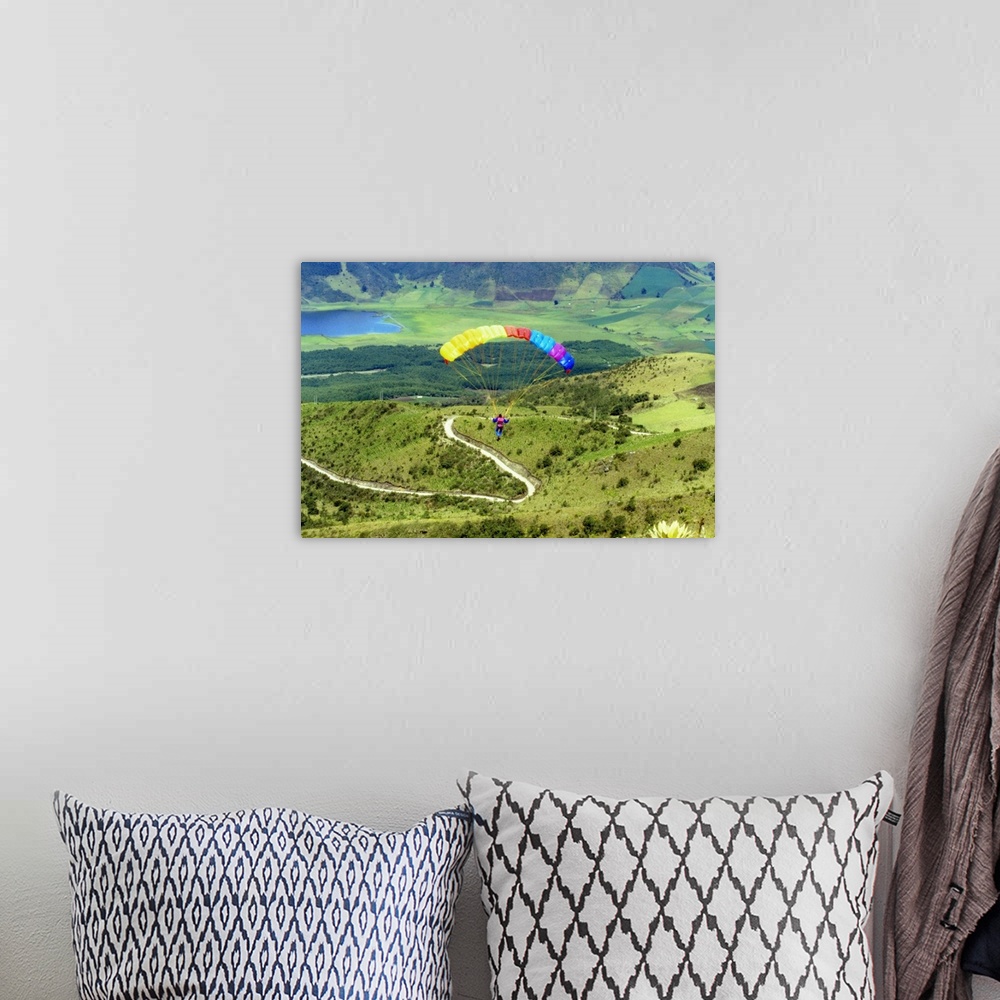 A bohemian room featuring Aerial view of a person paragliding
