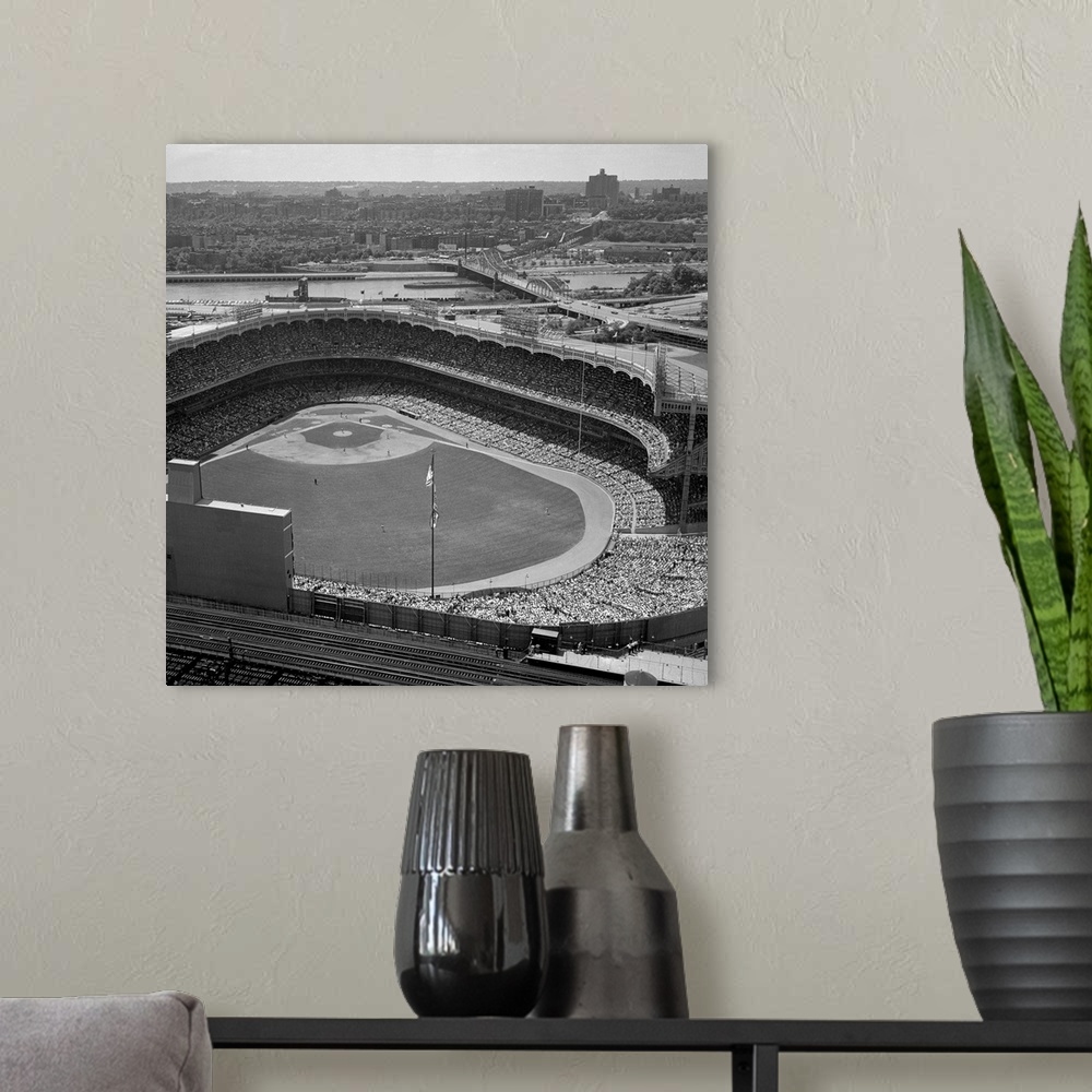 A modern room featuring This photo shows the holiday crowds at Yankee Stadium for the Yanks-Detroit double header.