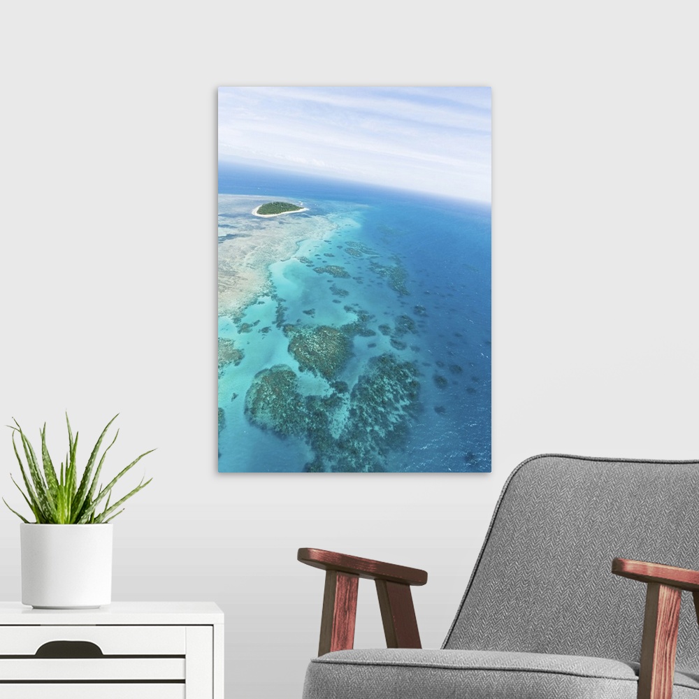 A modern room featuring Clear blue tropical water, Green Island and Great Barrier Reef from above by helicopter